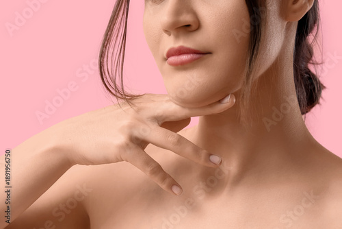 Young woman on pink backgro...