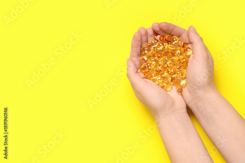 Female hands with vitamin E...