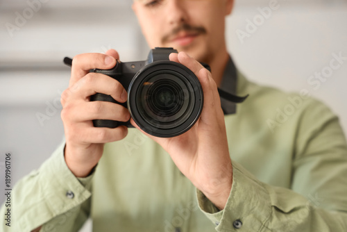 Male photographer with came...