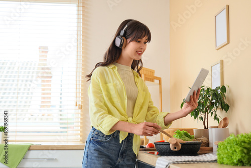 Young woman in headphones w...