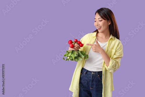 Young Asian woman pointing ...