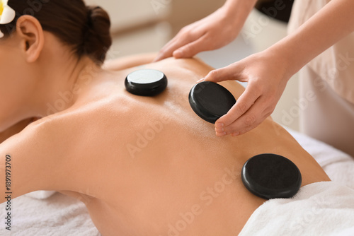 Young woman getting massage...