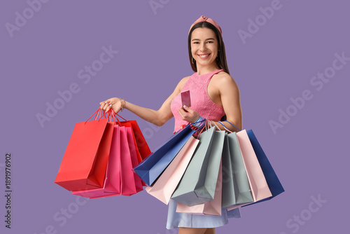 Happy young woman with cred...