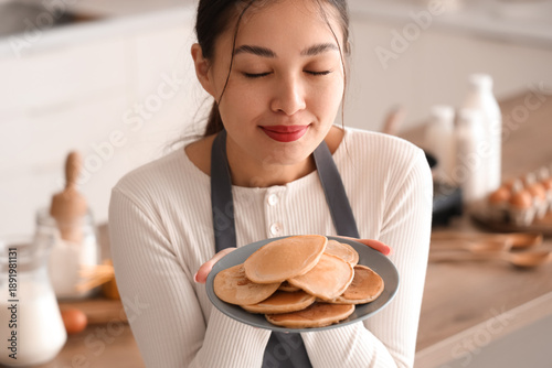 Beautiful young happy Asian...