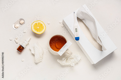 Cuadro en lienzo Rapid influenza test with cup of tea, thermometer, medications and tissues on wh