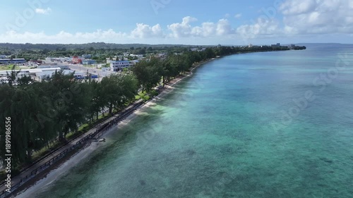 Wallpaper Mural Trace the path of endurance in paradise. This sweeping aerial footage captures the renowned coastal running course along Saipan's west coast, famous for hosting international marathons. Stretching fro Torontodigital.ca