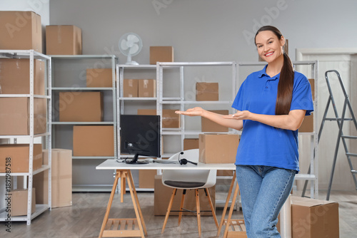 Smiling female warehouse wo...