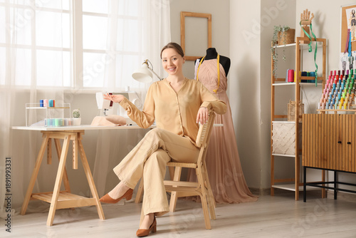 Young happy female tailor s...