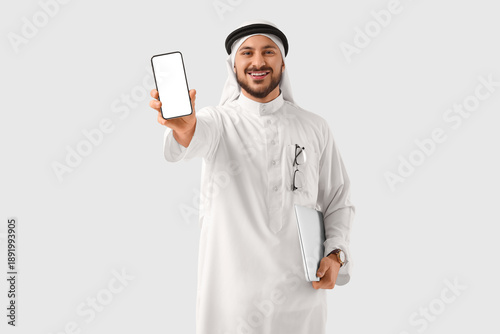 Arab businessman with blank...