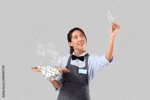 Young Asian smiling waitres...
