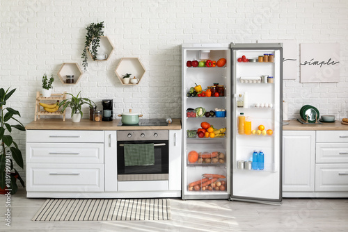 Open fridge full of fresh f...