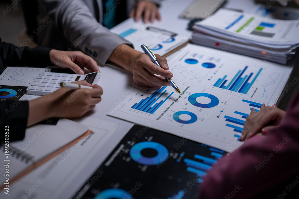 © apichat - Business people analyzing financial data charts in meeting © apichat - Business people analyzing financial data charts in meeting