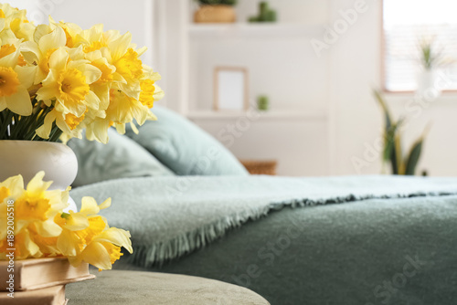 Vase with daffodils and boo...