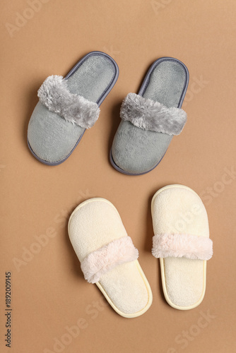 Two pairs of slippers on br...