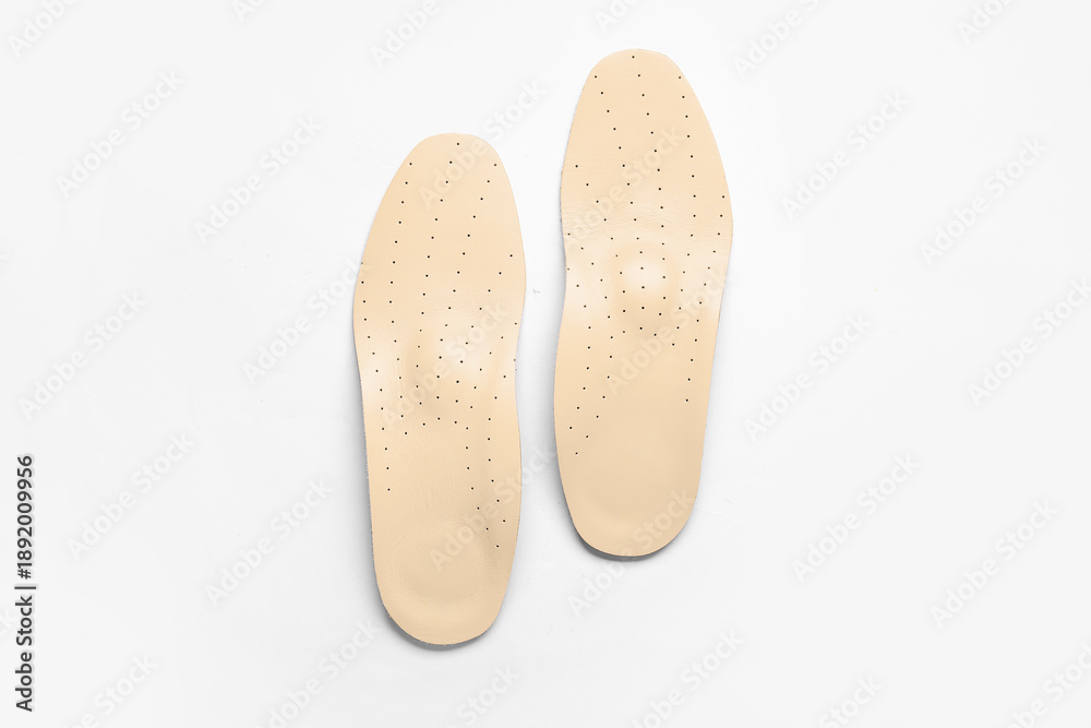 Fototapeta premium Leather orthopedic insoles isolated on white background