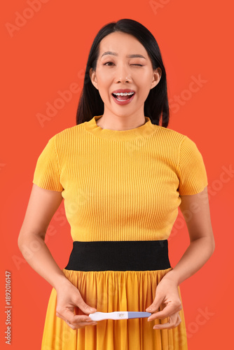 Happy young Asian woman wit...