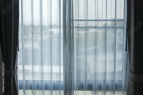 Photography Calm and peaceful room interior with soft light filtering through sheer white curtain