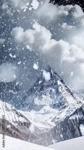 Wallpaper Mural Imposing snow-covered mountain summit amidst swirling clouds and falling flakes Torontodigital.ca
