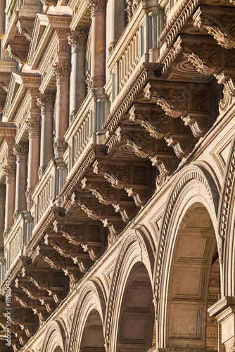 Quadro su tela Close-up of classical architectural stone arches and decorative carvings on a Mi