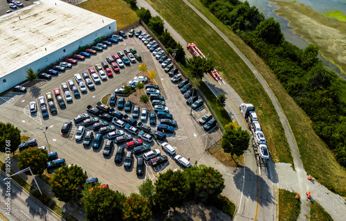 An aerial view of a car dealership parking lot in the Midwest
