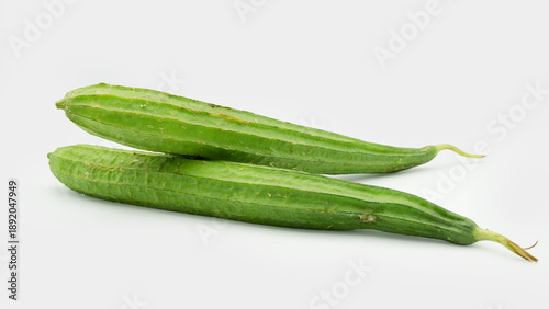 Photos fresh luffa acutangula isolated on white
