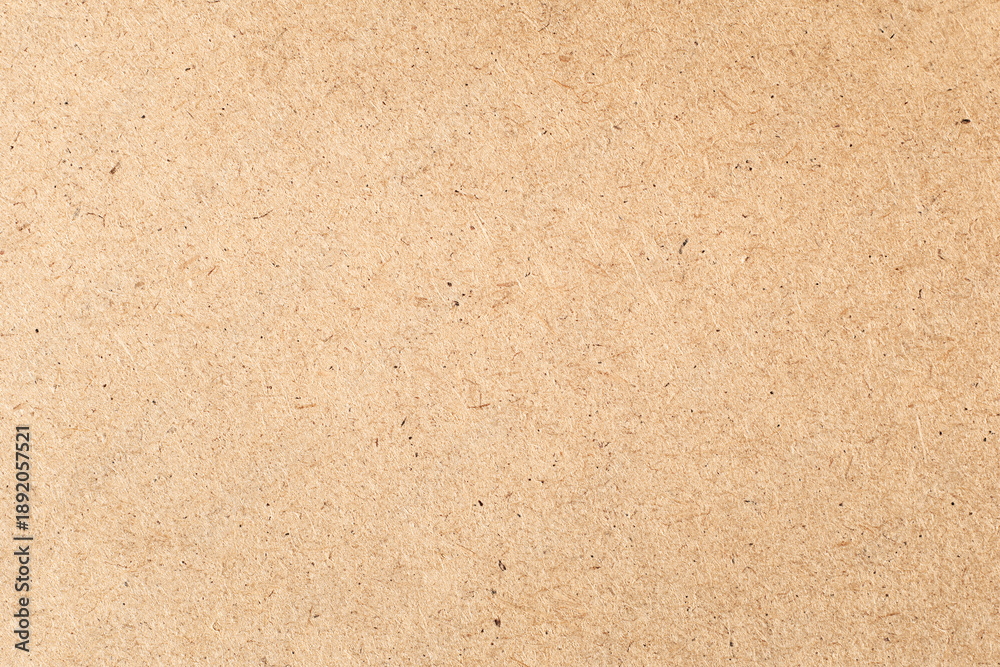 Fototapeta premium Brown paper background close-up with copy space