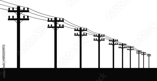 A receding line of utility poles with overhead power lines creating a perspective effect in silhouette
