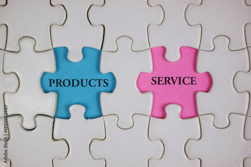 Fototapeta premium Blue 'PRODUCTS' and pink 'SERVICE' puzzle pieces symbolize collaboration and integration.