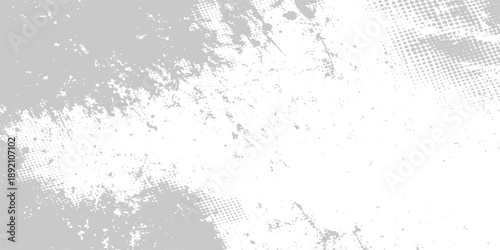 Vintage abstract grunge background featuring a textured black ink splat on an aged grey concrete wall surface with a rough paint pattern and dusty film grain material