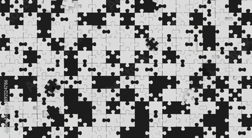 Abstract background featuring a dynamic arrangement of scattered black and white jigsaw puzzle pieces creating a complex modern pattern for visual design concepts and challenges