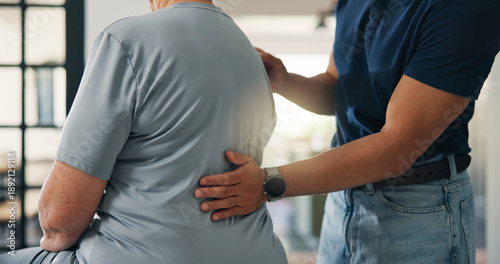 Tableau sur toile Hands, person and back pain with physiotherapist in home for assessment, spine injury and recovery