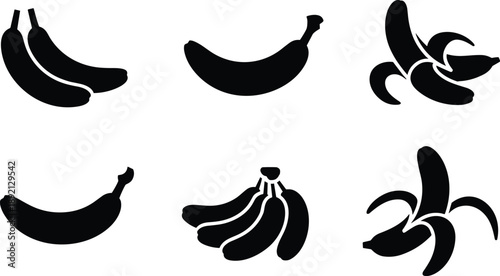 Set of black silhouettes of fresh bananas including whole fruit bunches and peeled skins isolated on a plain white background