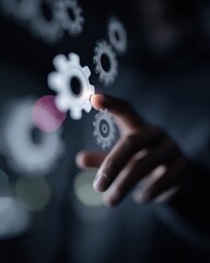 Close up of hand touching gear icons for operational excellence and industrial management efficiency on futuristic digital interface with purple and pink glow
