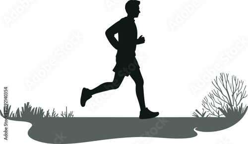 Silhouette of a male runner in motion on a path with grass and bushes indicating an outdoor exercise or sports activity