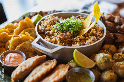 Фотография Caribbean Latin American food feast platter with arroz mamposteao stir-fried ric