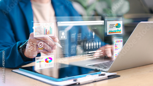 Fotografi Business professional analyzing data and dashboards on digital devices