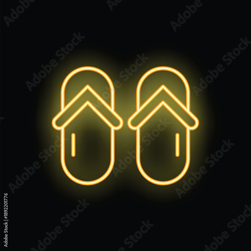 Yellow neon sign of a pair of flip flops glowing on a black background