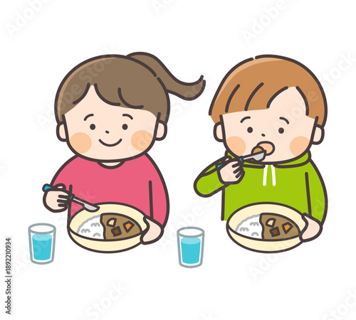 カレーライスを食べる男の子と女の子のイラスト