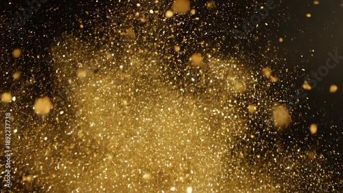 Wallpaper Mural Isolated bright golden glitter explosion bursting and scattering across a clean dark background designed as a luxury cinematic special effect overlay vfx, vibrant, bright Torontodigital.ca