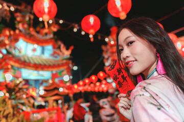 Young Girl Celebrating Lunar New Year with Bright Lanterns and Decorations