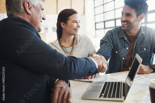 Photos Business, handshake and smile of couple with financial advisor for investment or savings success
