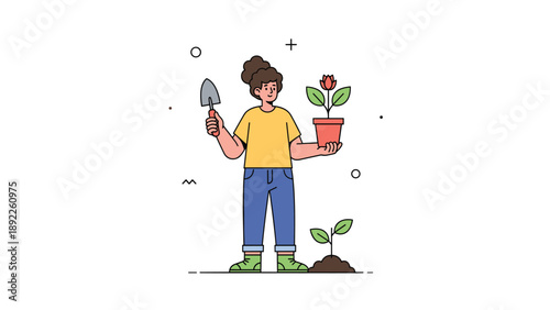 Female gardener with curly hair holding a small trowel and a potted plant with a red flower ready for transplanting into the garden soil.