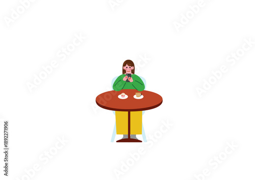 カフェで写真を撮る女性