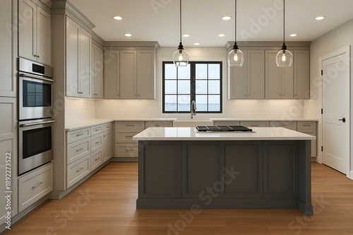 Luxurious modern kitchen interior featuring gray shaker cabinets, a dark island, stainless steel appliances, subway tile backsplash, and wood flooring.