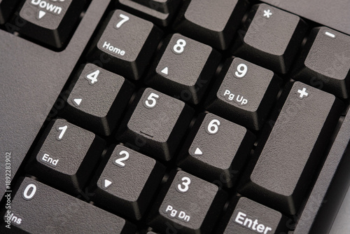 фотографія Close up of numeric keypad on computer keyboard representing calculation, number