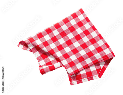 A vibrant, folded red and white checkered cloth against a stark, black background