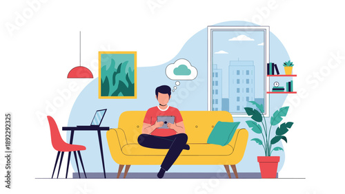 Young man sitting comfortably on a yellow sofa using a tablet while thinking of cloud data and working from home in a cozy living room.