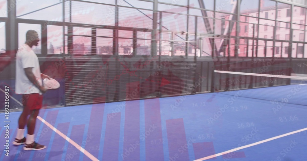 Fototapeta premium Standing man holding paddle at line on blue court with net, glass, charts, red-shorts, copy space