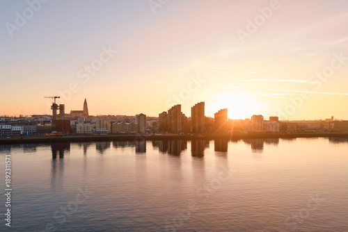 Reykjavik city skyline at sunrise over sæbraut bay