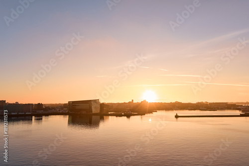 Reykjavik harbor waterfront reflecting warm golden hour